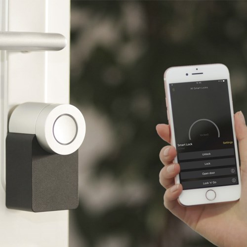 Homeowner checking security cameras on a smartphone